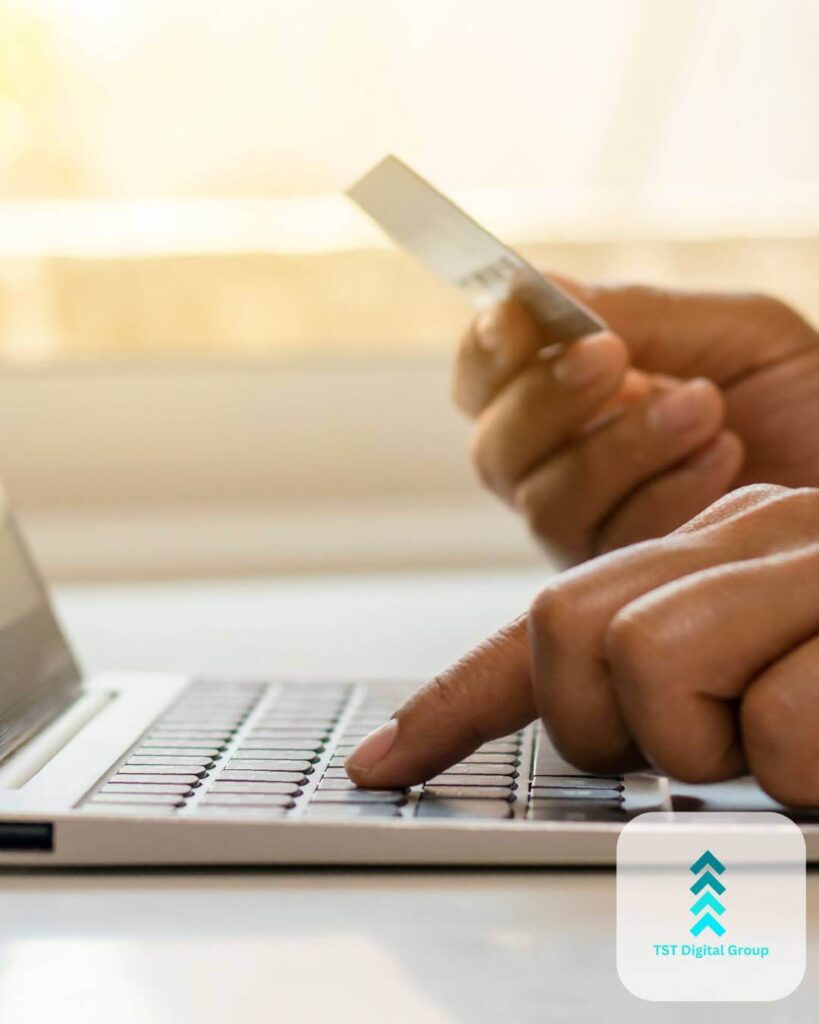 Close-up of a person entering credit card details on a laptop, representing pay-per-click management and digital marketing services by TST Digital Agency in Alamo Heights, San Antonio, Texas.