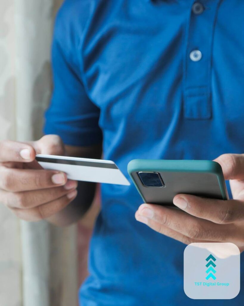 Man holding a smartphone and credit card, illustrating PPC strategies, search engine marketing, and online advertising solutions by TST Digital Agency in Terrell Hills, Texas.